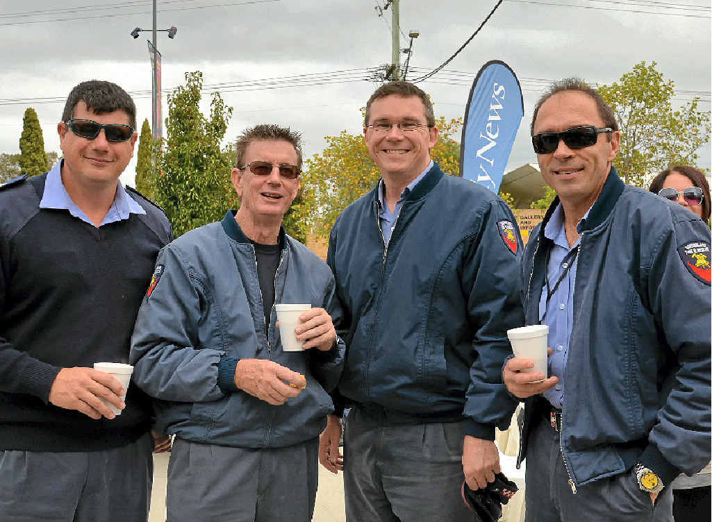 FIRES AND FRIENDS: Local fire fighters Brad Davie, Michael Combes, Tony Brennan and Darren Welsh take a break at the Warwick Daily News morning tea.